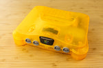 Load image into Gallery viewer, HDMI Modded N64 (Clear Light Orange)
